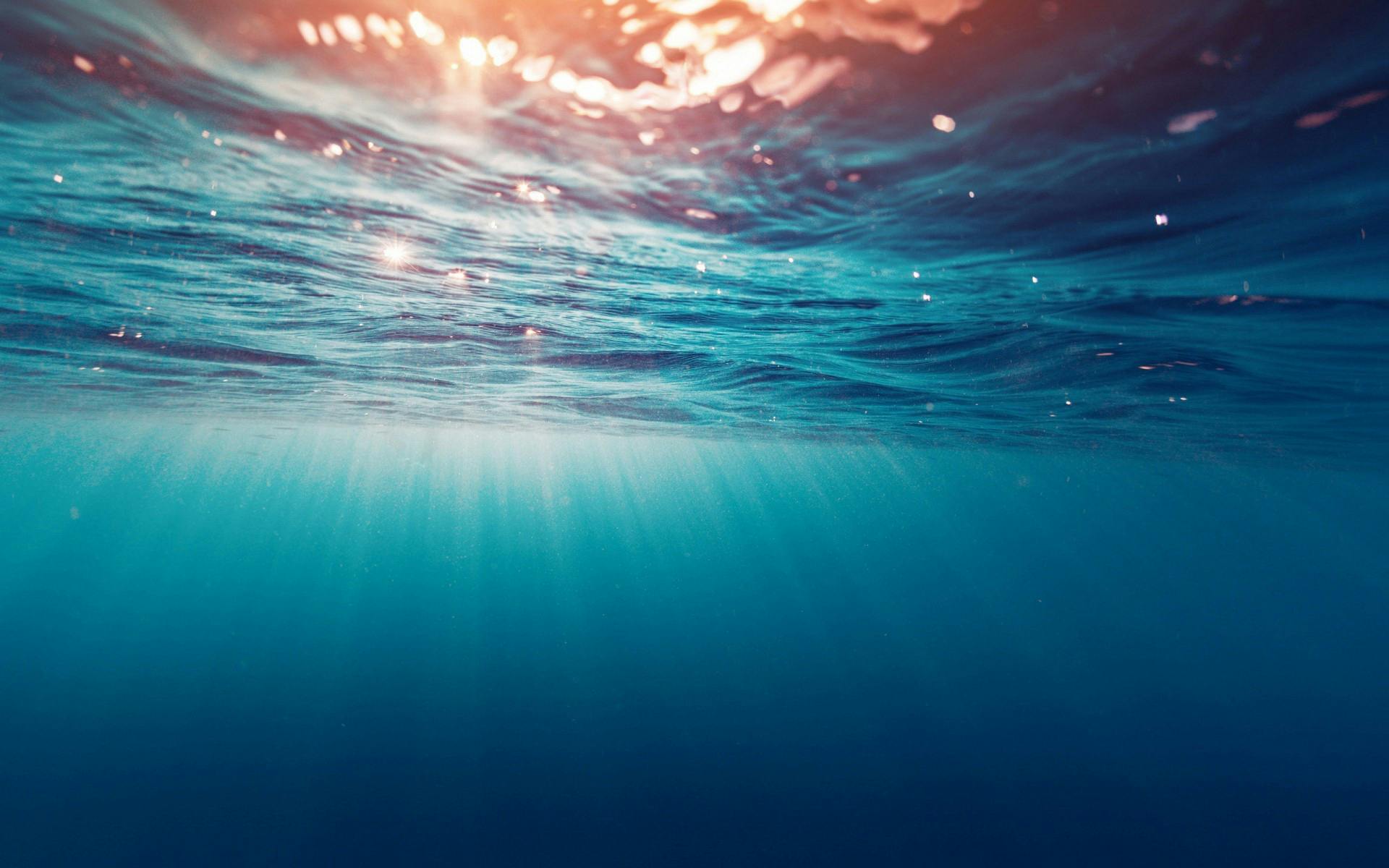 Background image of water surface with color light rays